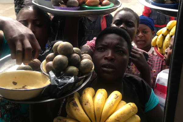Women selling fruits at a local market in Mbeya, Tanzania